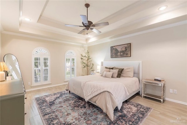 2009 E 29th St, Mission, TX 78574 - bedroom with a raised ceiling, light wood finished floors, crown molding, baseboards, and recessed lighting