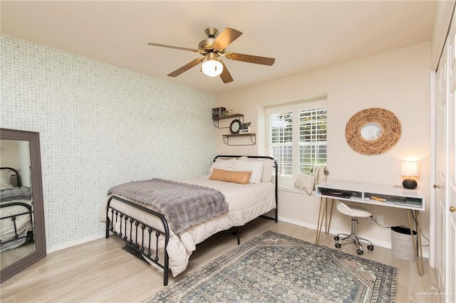 2009 E 29th St, Mission, TX 78574 - bedroom featuring baseboards, wood finished floors, and ceiling fan
