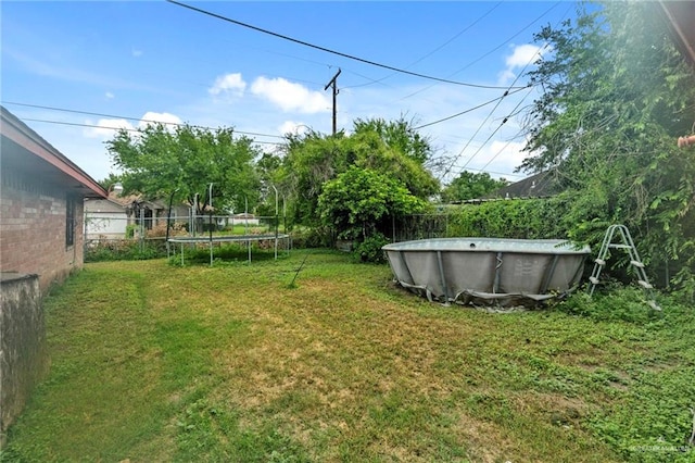 view of yard featuring a trampoline