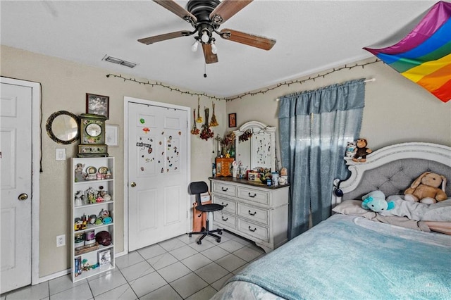 bedroom with light tile patterned floors and ceiling fan