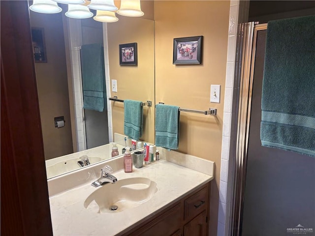 bathroom with vanity and an enclosed shower