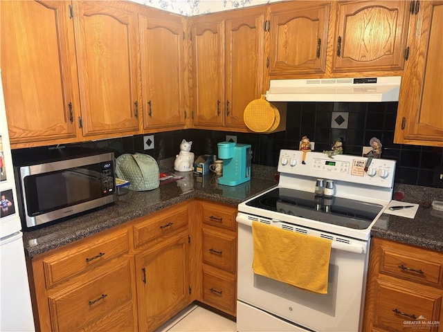 kitchen with electric stove, light tile patterned floors, and decorative backsplash