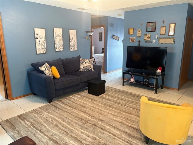 living room with tile patterned flooring