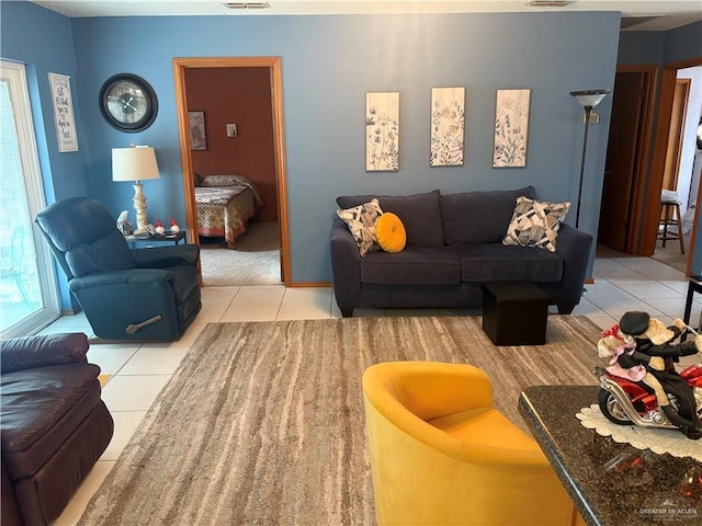 living room with light tile patterned floors