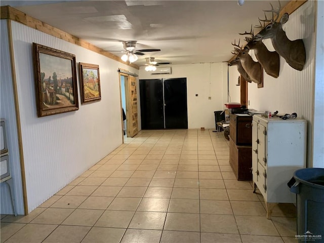 interior space with ceiling fan and light tile patterned floors