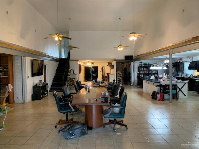 interior space with light tile patterned floors and high vaulted ceiling