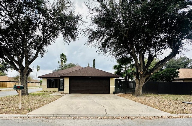 single story home featuring a garage