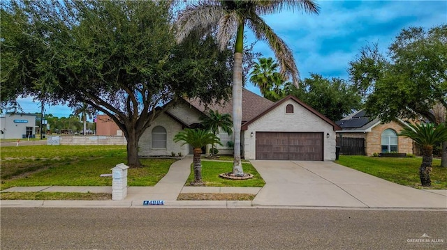 ranch-style house with a garage and a front lawn