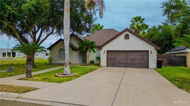 ranch-style home featuring a garage and a front lawn