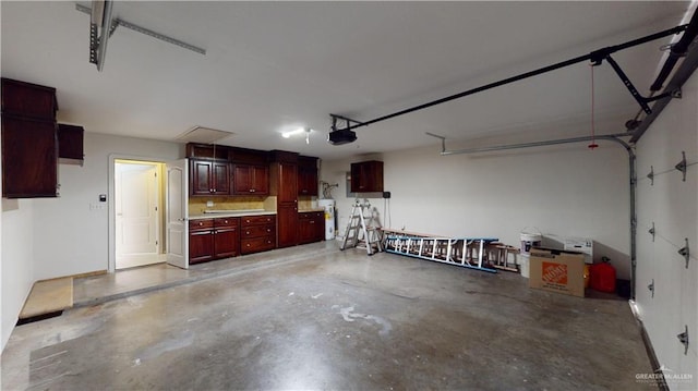 garage featuring a garage door opener and electric water heater