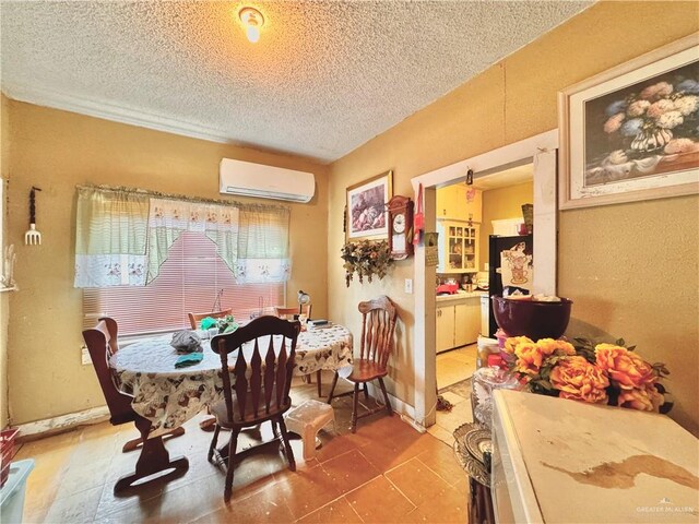 tiled dining area featuring a textured ceiling and a wall unit AC