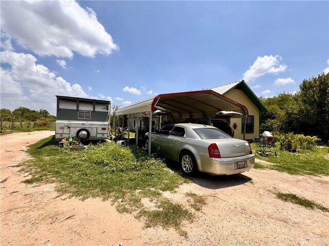 view of parking / parking lot with a carport