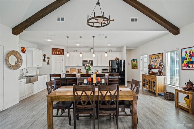35206 Longhorn Dr, Linn, TX 78563 - dining area featuring beamed ceiling, high vaulted ceiling, light wood-style flooring, a chandelier, and recessed lighting