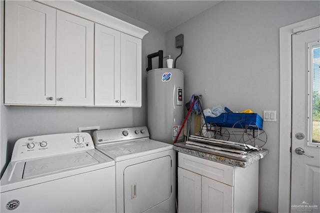 35206 Longhorn Dr, Linn, TX 78563 - laundry area featuring water heater, washer and dryer, and cabinet space