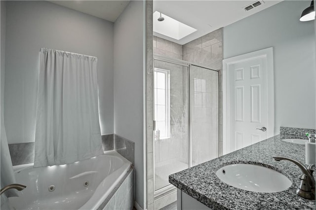35206 Longhorn Dr, Linn, TX 78563 - full bathroom with a stall shower, a jetted tub, a skylight, and double vanity