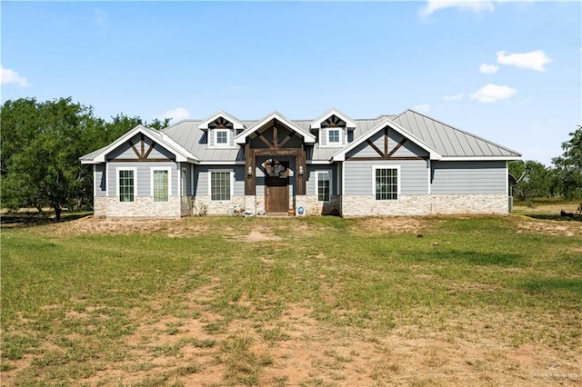 35206 Longhorn Dr, Linn, TX 78563 - craftsman-style house featuring stone siding, a front yard, and metal roof