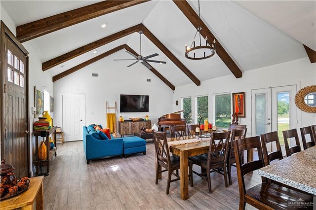 35206 Longhorn Dr, Linn, TX 78563 - dining area featuring high vaulted ceiling, beamed ceiling, light wood finished floors, a ceiling fan, and french doors