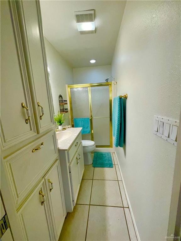 739 E Clam Cir Unit 739, Port Isabel, TX 78578 - bathroom featuring tile patterned floors, toilet, vanity, and walk in shower