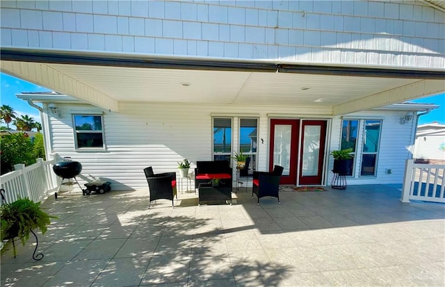 exterior space featuring a patio area and an outdoor hangout area