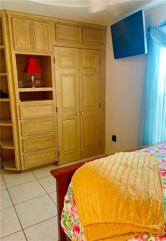 bedroom featuring light tile patterned floors