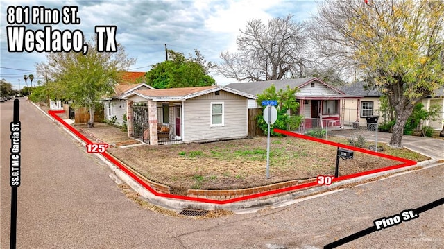 801 N Pino St, Weslaco, TX 78596 - ranch-style house with fence