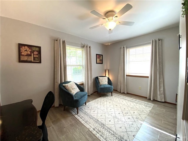 sitting room featuring ceiling fan