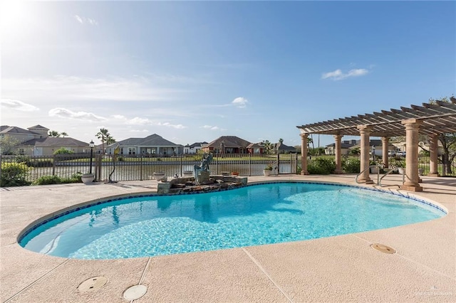 view of pool with a pergola and a patio