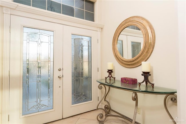 doorway featuring tile patterned flooring and french doors