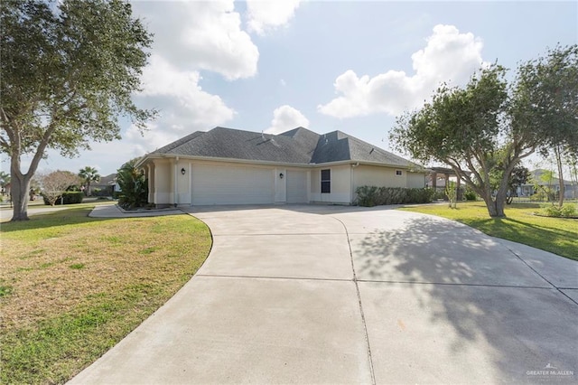 ranch-style home with a garage and a front lawn