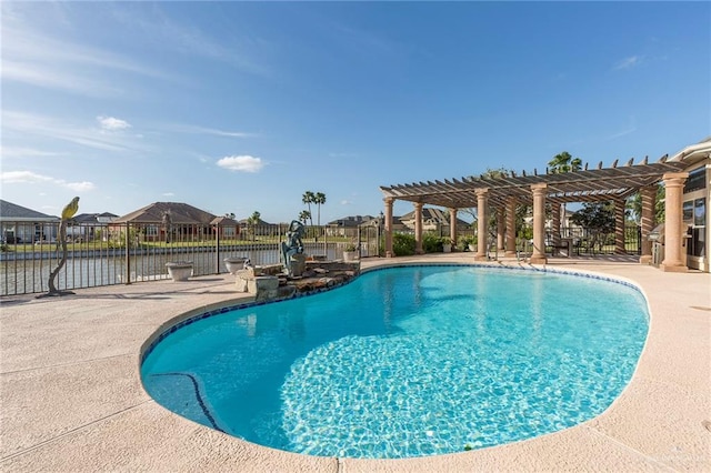 view of pool with a patio area, a water view, and a pergola