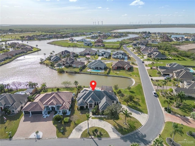 birds eye view of property with a water view