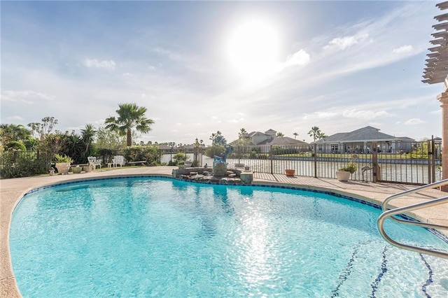 view of pool featuring a water view