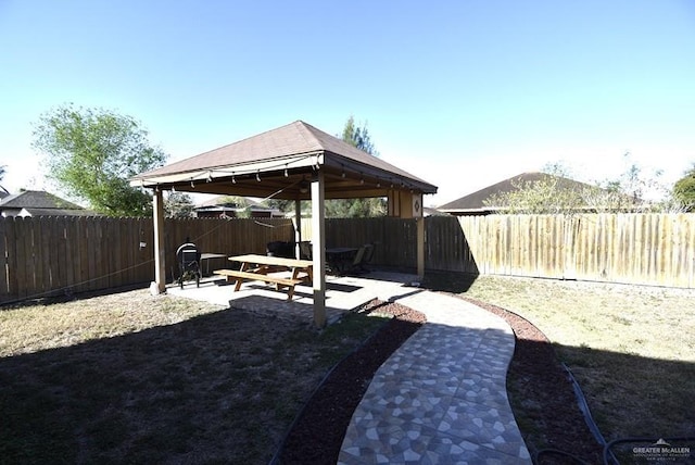 view of yard with a gazebo, a fenced backyard, and a patio