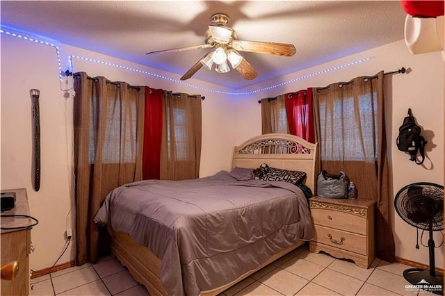 tiled bedroom with ceiling fan