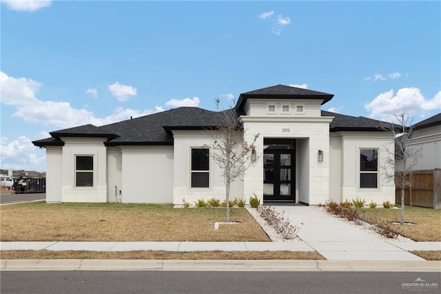 prairie-style home with a front lawn