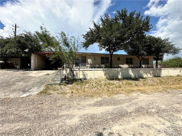 view of front facade featuring a carport