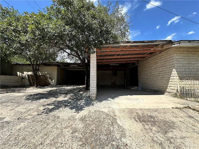 exterior space featuring a carport