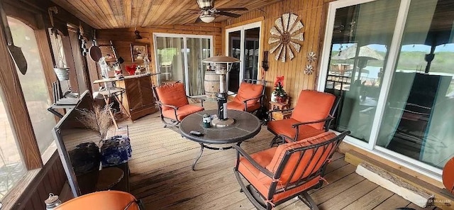 interior space featuring vaulted ceiling, ceiling fan, and wooden ceiling