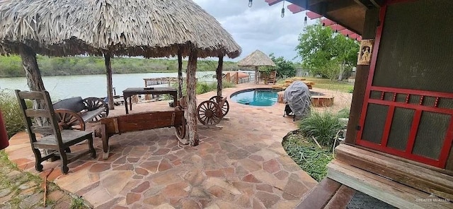 view of patio featuring a water view