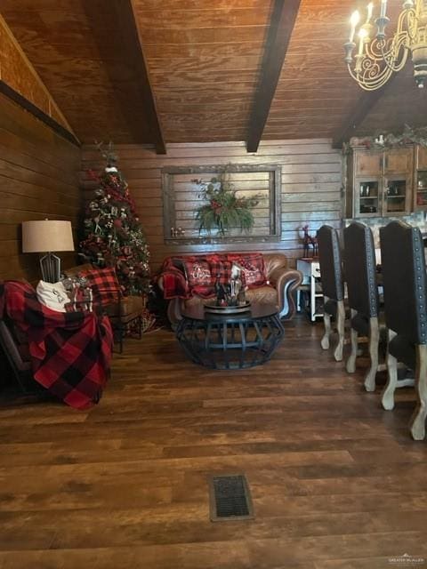 dining room with hardwood / wood-style floors, wooden walls, and wood ceiling