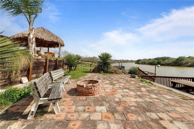 view of swimming pool with a gazebo, a patio area, and pool water feature