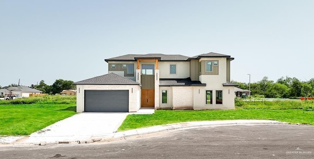 view of front facade featuring a front lawn and a garage