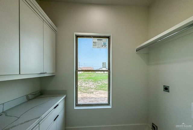 laundry area featuring cabinets and hookup for an electric dryer