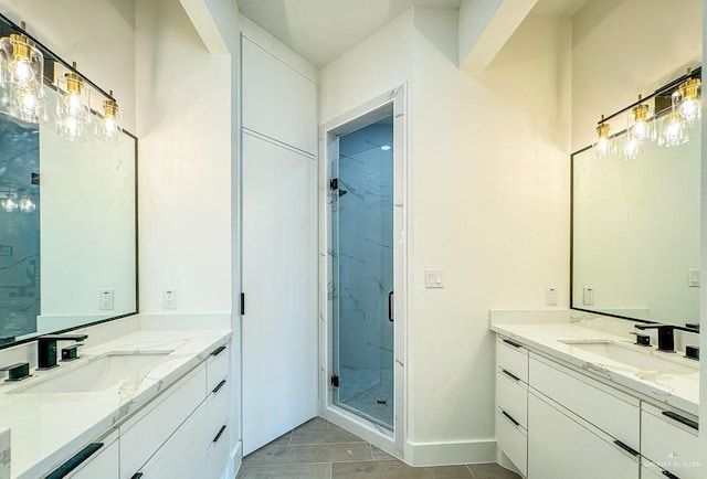 bathroom featuring vanity and an enclosed shower