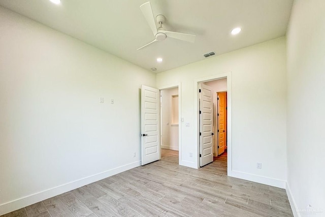 unfurnished bedroom featuring ceiling fan and light hardwood / wood-style floors