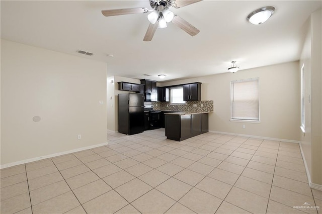 kitchen with decorative backsplash, stainless steel fridge, ceiling fan, and a healthy amount of sunlight