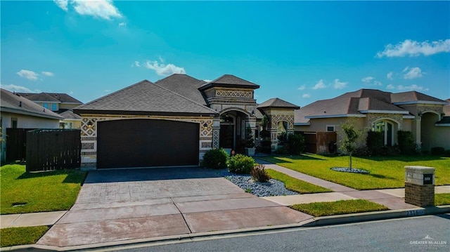 view of front facade featuring a garage and a front lawn