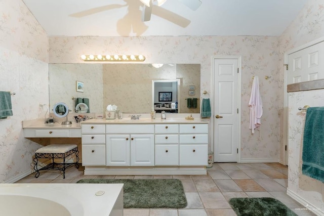 131 E Hibiscus St, South Padre Island, TX 78597 - bathroom with wallpapered walls, vanity, and baseboards