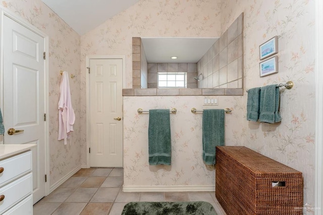 131 E Hibiscus St, South Padre Island, TX 78597 - bathroom with baseboards, tile patterned flooring, and wallpapered walls