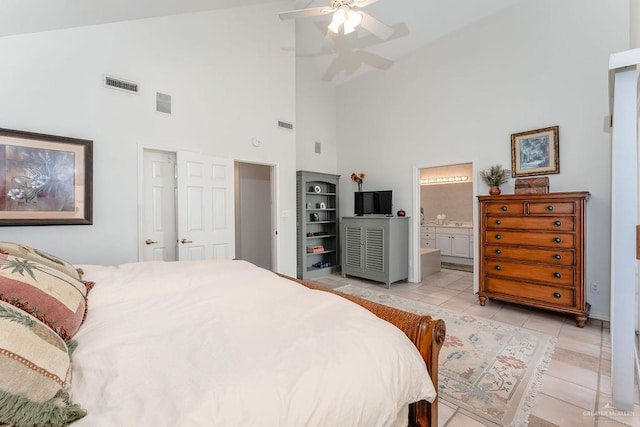 131 E Hibiscus St, South Padre Island, TX 78597 - bedroom with light tile patterned floors, visible vents, ensuite bathroom, and ceiling fan